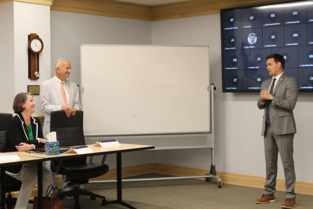 AOC Director Ryan Boyce thanking Mary Pollard for her service